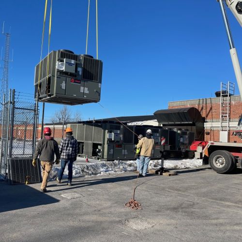 Photo of a crane lifting a box