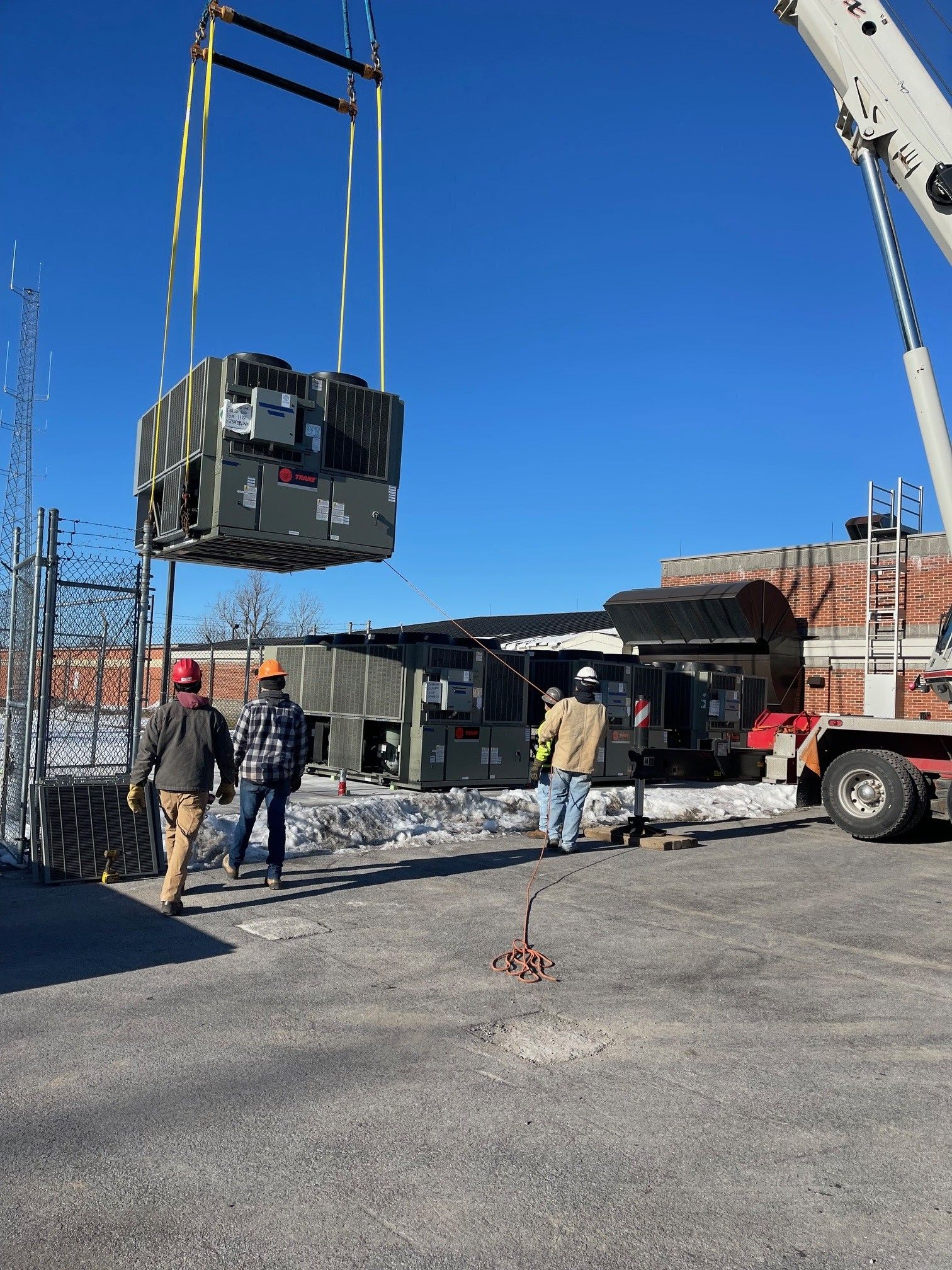 Photo of a crane lifting a box